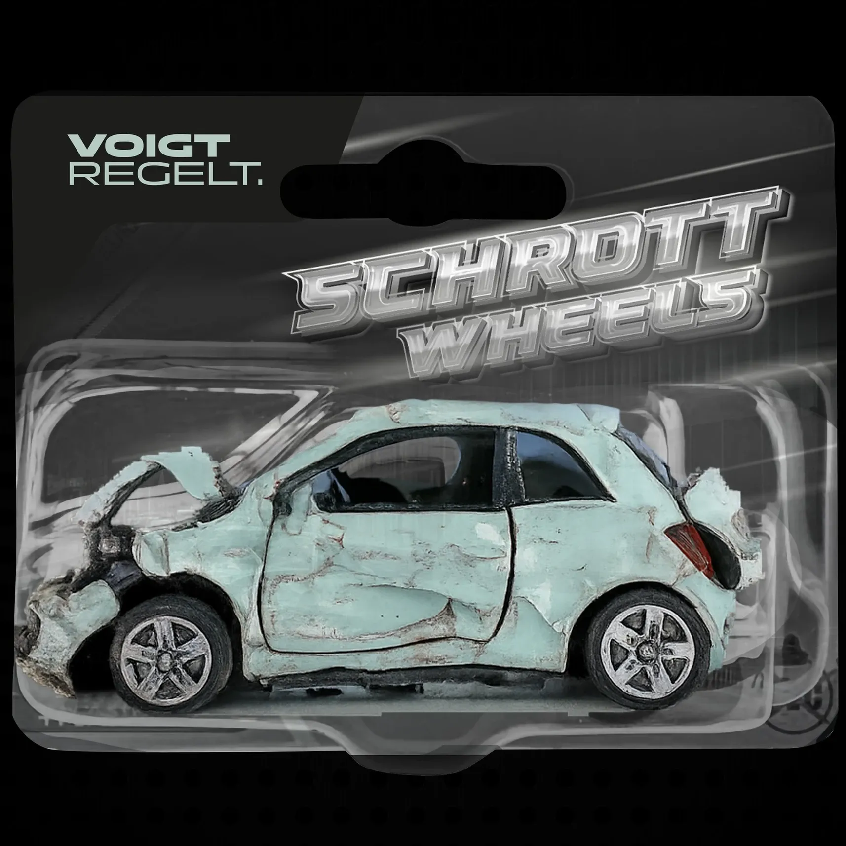 Blisterverpackung mit mintgrünem, zerbeultem Spielzeugauto und dem Schriftzug 'Schrott Wheels'