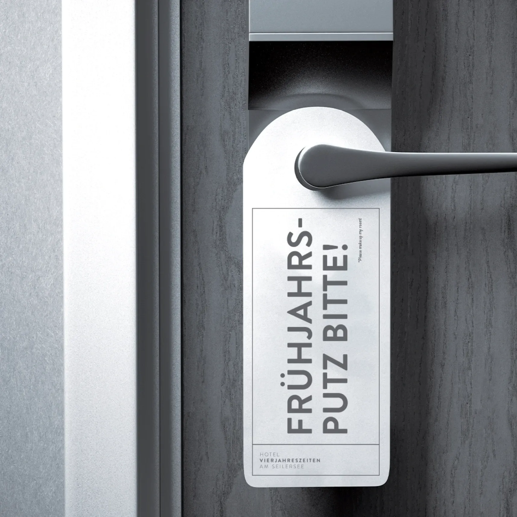 Hotel-Türgriff mit Türanhänger 'Frühjahrsputz bitte'