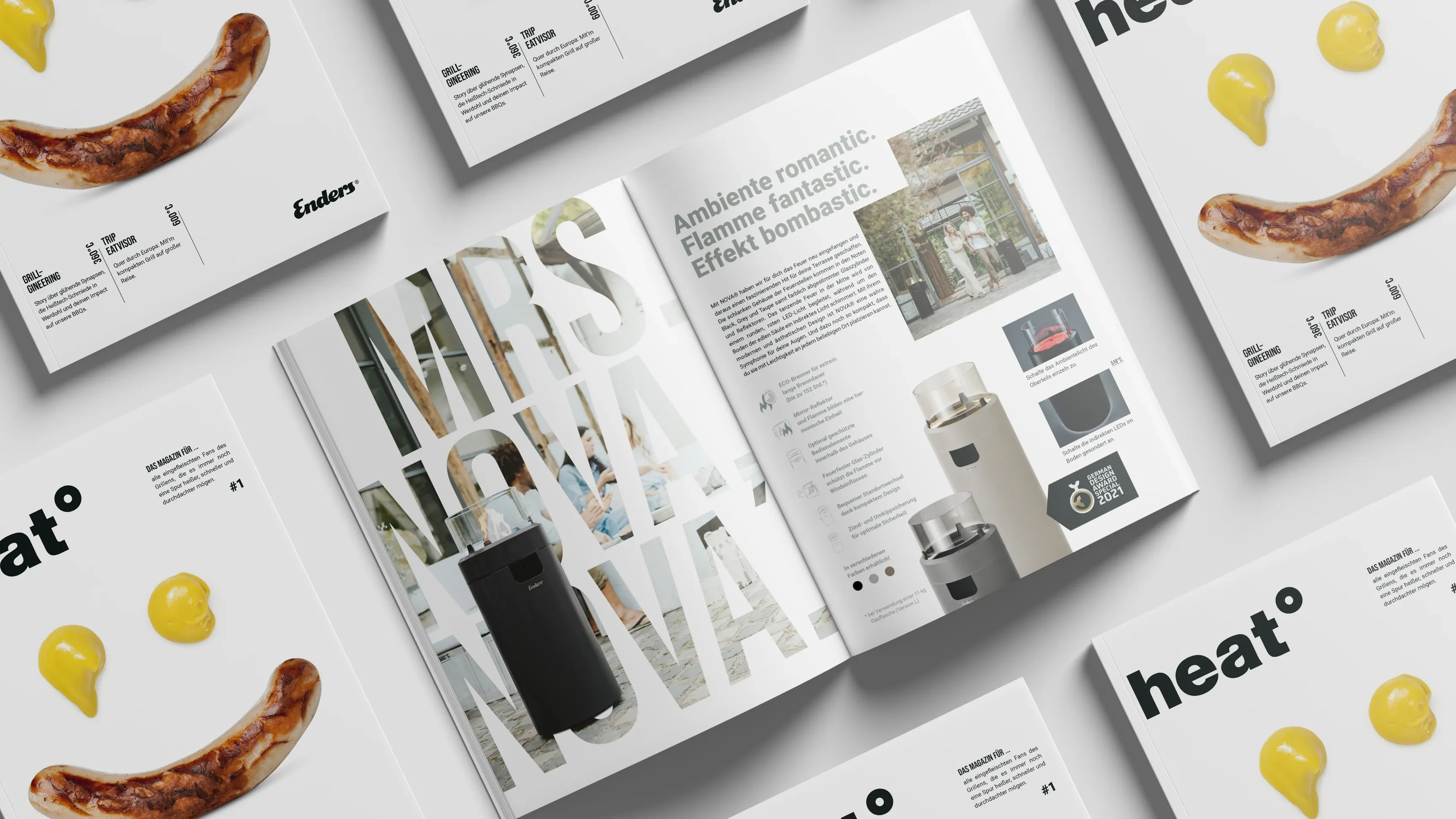 Draufsicht auf mehrere 'heat°'-Magazine, Cover mit Bratwurst und gelben Punkten, ein Heft aufgeschlagen