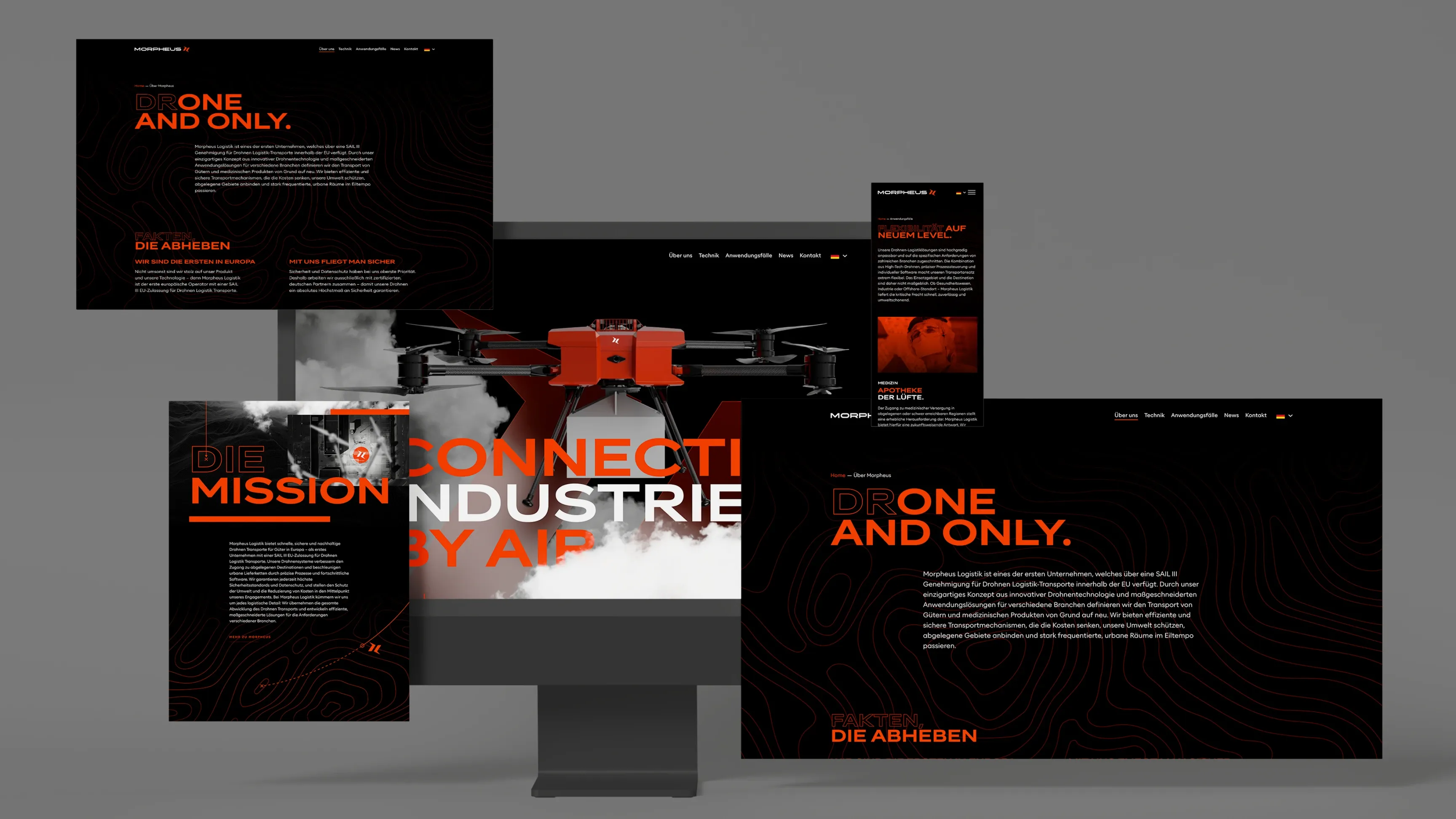 Mehrere Webdesign-Mockups in Schwarz und Orange um einen Monitor mit rotem Quadrocopter