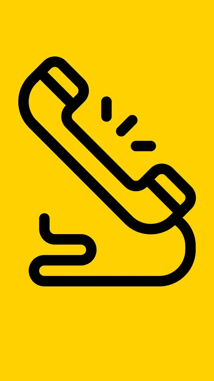 Schwarzes Icon eines klingelnden Telefonhörers auf gelbem Hintergrund